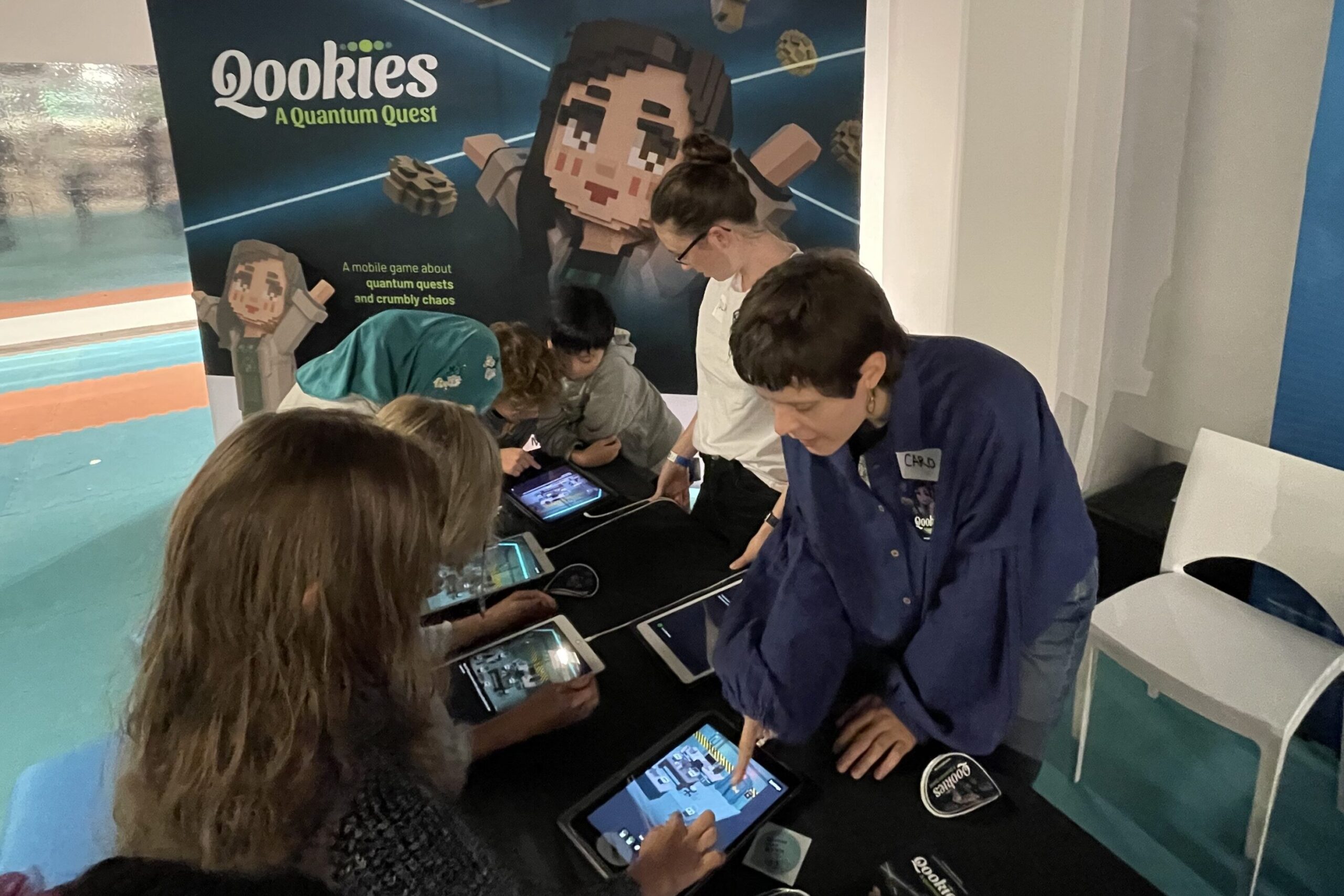 At the GALaQSci booth at FORSCHA our staff is explaining to children and adults how to play our mobile game Qookies.
